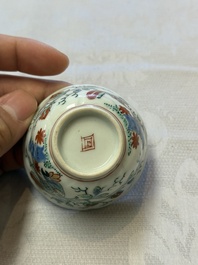 Two Dutch-decorated Chinese cups and saucers with parrots among flowering branches, 18th C.