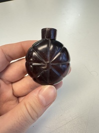 Two Chinese glass snuff bottles and a buffalo bone snuff bottle, Xianfeng mark, 19th C.