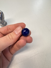 A Chinese blue, white and copper-red 'Dragon' snuff bottle, 19th C.