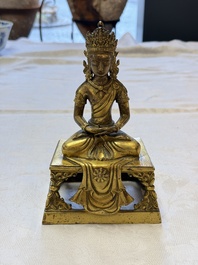 A Sino-Tibetan gilt-bronze figure of Buddha Amitayus, inscribed, Qianlong