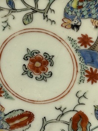 Two Dutch-decorated Chinese cups and saucers with parrots among flowering branches, 18th C.
