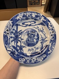 A fine Chinese blue and white 'Elegant Beauties' dish with raised central medallion, Kangxi