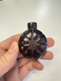 Two Chinese glass snuff bottles and a buffalo bone snuff bottle, Xianfeng mark, 19th C.