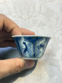A Chinese European-decorated blue and white 'Fisherman' cup and saucer, Kangxi