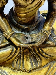 A Sino-Tibetan gilt-bronze figure of Buddha Amitayus, inscribed, Qianlong