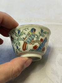 Two Dutch-decorated Chinese cups and saucers with parrots among flowering branches, 18th C.
