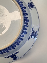 A fine Chinese blue and white 'Elegant Beauties' dish with raised central medallion, Kangxi