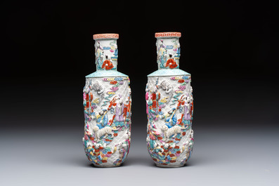 A pair of Chinese famille rose relief-moulded 'Immortals' vases, Qianlong mark, Republic
