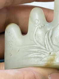 A Chinese white jade mountain-shaped brush rest with narcissus design, Dajie 大玠 mark, dated 1879