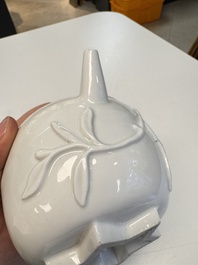 A Chinese Dehua blanc de Chine 'Pomegranate' teapot and cover, Kangxi