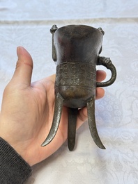 A Chinese archaistic bronze ritual wine vessel, Jue 爵, Qianlong mark, dated 1738