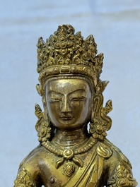 A Sino-Tibetan gilt-bronze figure of Buddha Amitayus, inscribed, Qianlong