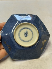A pair of Chinese gilt-decorated powder-blue-ground 'Antiquities' cups and saucers, lingzhi mark, Kangxi
