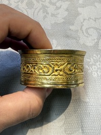 A fine Tibetan gilt-bronze box and cover with repouss&eacute; scroll decoration, 18th C.