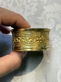 A fine Tibetan gilt-bronze box and cover with repouss&eacute; scroll decoration, 18th C.