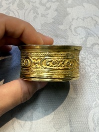 A fine Tibetan gilt-bronze box and cover with repouss&eacute; scroll decoration, 18th C.