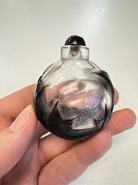 Two Chinese glass snuff bottles and a buffalo bone snuff bottle, Xianfeng mark, 19th C.