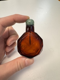 A Chinese facetted amber glass snuff bottle, 19th C.