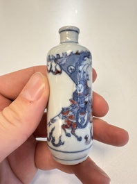 Two Chinese blue, white and copper-red snuff bottles with narrative design, 19th C.