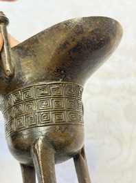 A Chinese archaistic bronze ritual wine vessel, Jue 爵, Qianlong mark, dated 1738