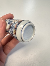 Three Chinese blue, white and copper-red snuff bottles with narrative design, 19th C.