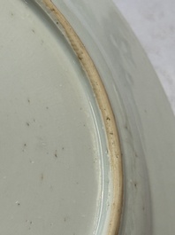 A pair of fine Chinese famille rose black-ground 'Scrolls and Flowers' plates, Yongzheng/Qianlong