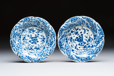 Eleven Chinese blue and white gadrooned 'Flowers and Peacocks' plates, Kangxi