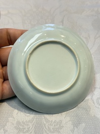 A Chinese European-decorated blue and white 'Fisherman' cup and saucer, Kangxi