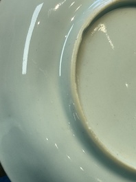 A Chinese European-decorated blue and white 'Fisherman' cup and saucer, Kangxi
