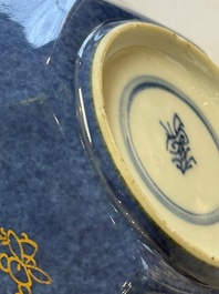 A pair of Chinese gilt-decorated powder-blue-ground 'Antiquities' cups and saucers, lingzhi mark, Kangxi