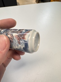 A fine Chinese blue, white and copper-red snuff bottle with narrative design, 19th C.