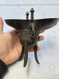 A Chinese archaistic bronze ritual wine vessel, Jue 爵, Qianlong mark, dated 1738
