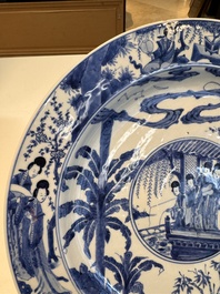 A fine Chinese blue and white 'Elegant Beauties' dish with raised central medallion, Kangxi