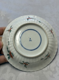 A pair of Chinese famille verte cups and saucers with floral design, Jade 玉 marks, 19th C.