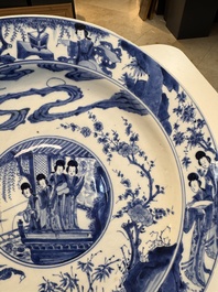 A fine Chinese blue and white 'Elegant Beauties' dish with raised central medallion, Kangxi