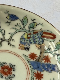Two Dutch-decorated Chinese cups and saucers with parrots among flowering branches, 18th C.