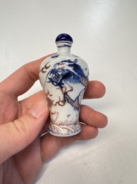 A Chinese blue, white and copper-red 'Dragon' snuff bottle, 19th C.