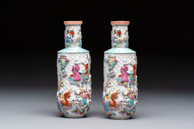 A pair of Chinese famille rose relief-moulded 'Immortals' vases, Qianlong mark, Republic