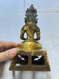 A Sino-Tibetan gilt-bronze figure of Buddha Amitayus, inscribed, Qianlong