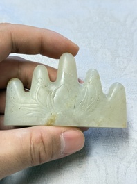 A Chinese white jade mountain-shaped brush rest with narcissus design, Dajie 大玠 mark, dated 1879