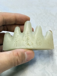 A Chinese white jade mountain-shaped brush rest with narcissus design, Dajie 大玠 mark, dated 1879