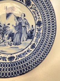 A Chinese blue and white 'La Dame au Parasol' plate after Cornelis Pronk, Qianlong
