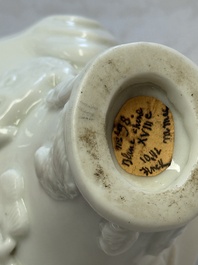 A Chinese Dehua blanc de Chine 'Dragon, Carp, Crane and Deer' libation cup, Kangxi