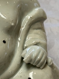 A Chinese white-glazed Milefo Buddha, 19th C.