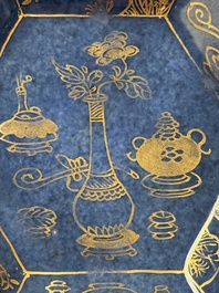 A pair of Chinese gilt-decorated powder-blue-ground 'Antiquities' cups and saucers, lingzhi mark, Kangxi
