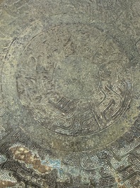 A Chinese archaic bronze tripod food vessel and cover, Ding 鼎, Eastern Zhou