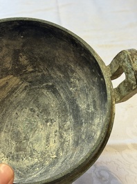 A Chinese archaic bronze tripod food vessel and cover, Ding 鼎, Eastern Zhou