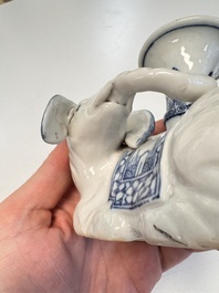 Two Chinese blue and white recumbent elephant-form candlesticks, Jiaqing