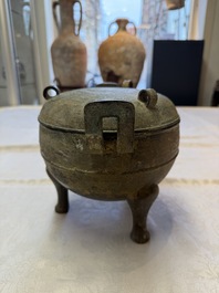 A Chinese archaic bronze tripod food vessel and cover, Ding 鼎, Eastern Zhou