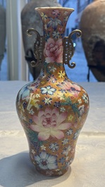 A pair of Chinese famille rose 'Millefleur' vases, Qianlong mark, Republic